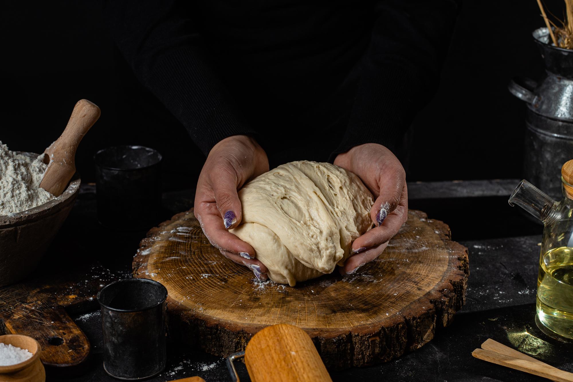Founder preparing sourdough in studio kitchen